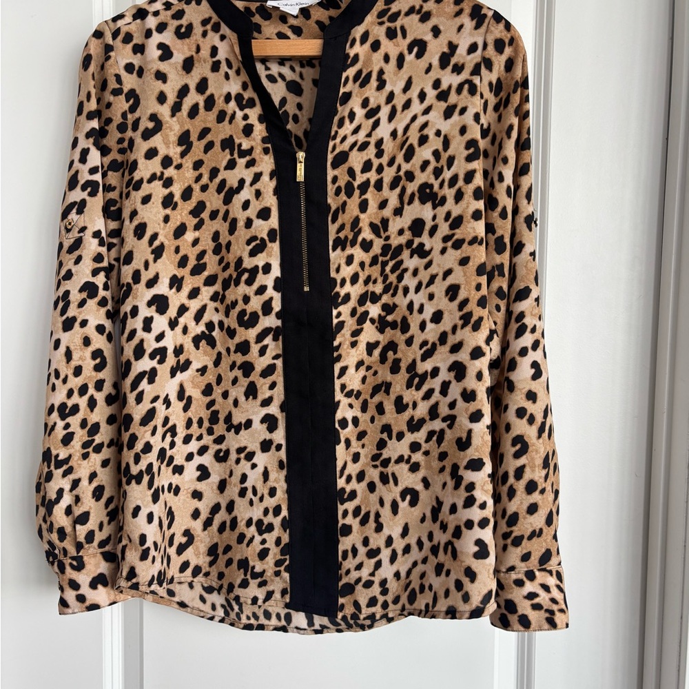 Beautiful Calvin Klein blouse top. Adjustable sleeve length. Like new.